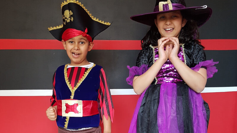 Kids wear spooky costumes